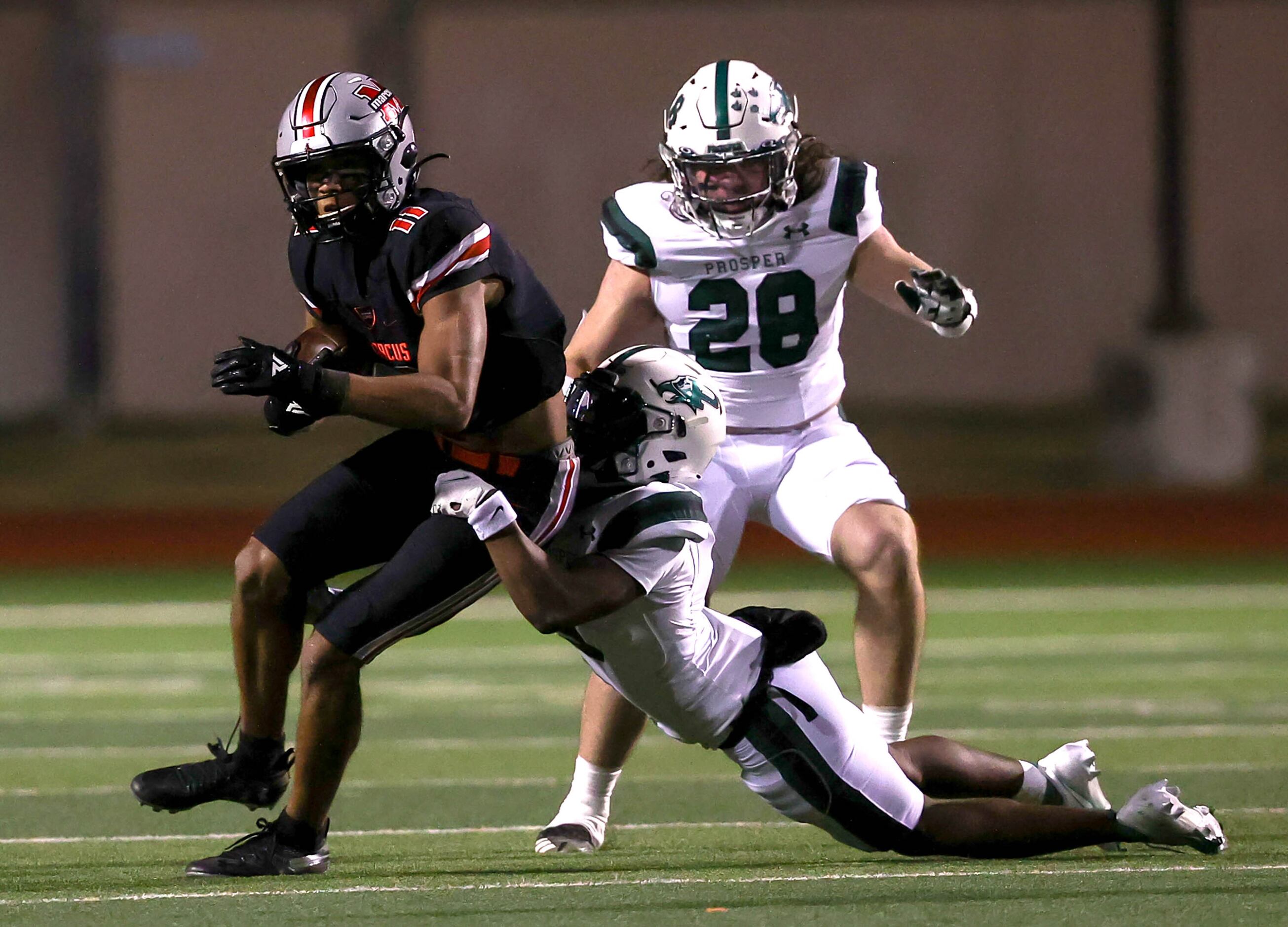 Flower Mound Marcus wide receiver Dallas Dudley (11) comes up with a reception against...