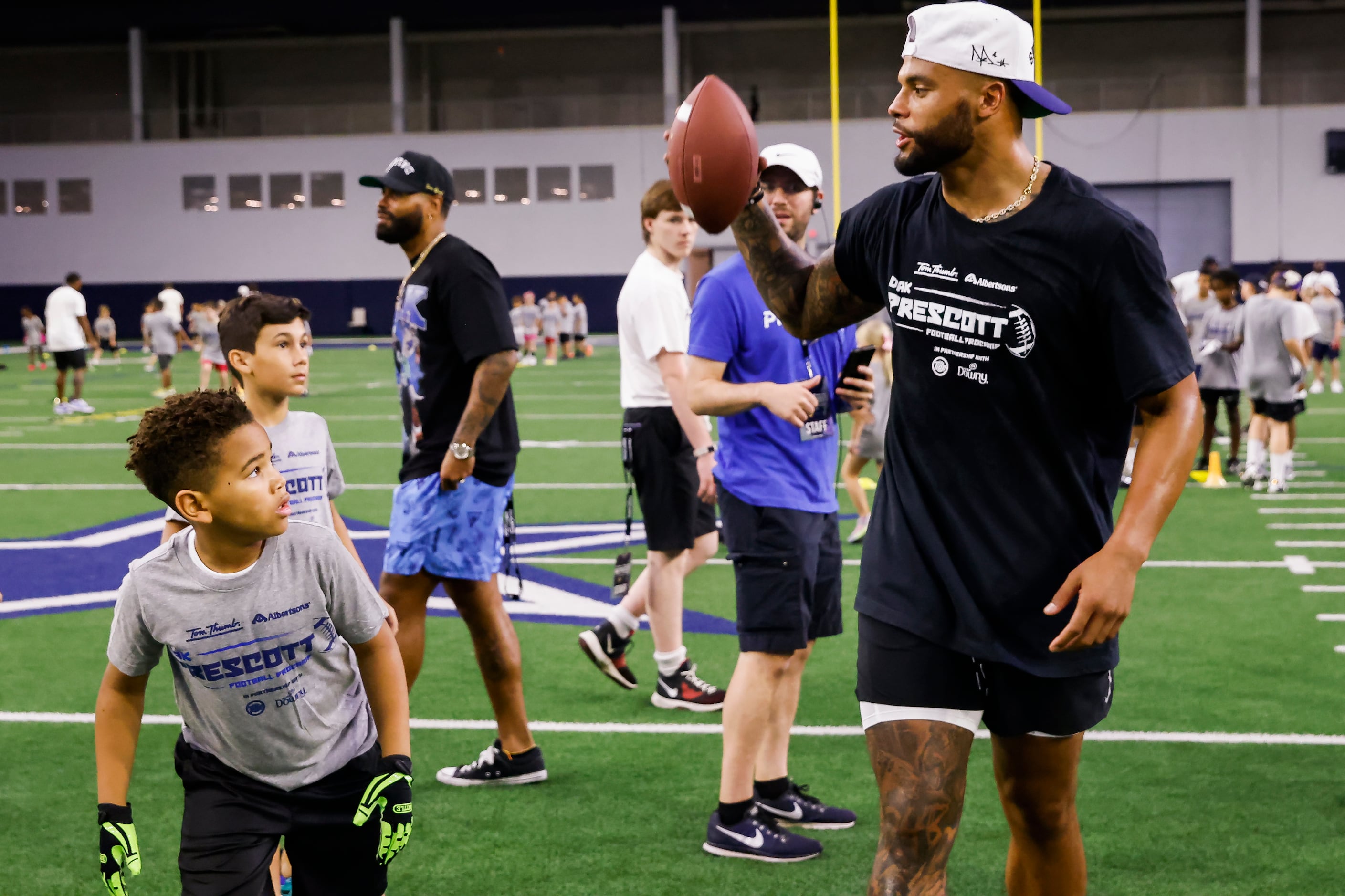 Photos: Cowboys' Dak Prescott run drills with students at his