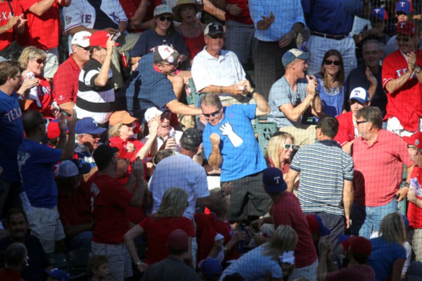 Texas Rangers second baseman Ian Kinsler throws off batting gear in frustration after lining...