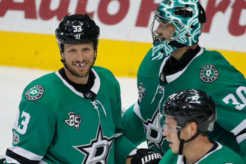 Dallas Stars defenseman Marc Methot (33) is all smiles after Dallas' 3-1 win during the...