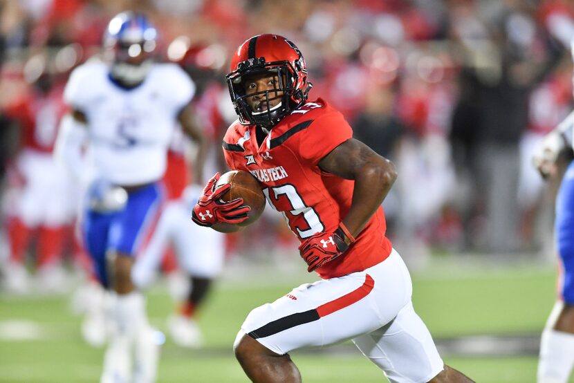 LUBBOCK, TX - SEPTEMBER 29: Cameron Batson #13 of the Texas Tech Red Raiders runs for a...