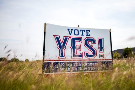 Pro-New Rangers Stadium signs stands on the Arlington Municipal Airport grounds. on Oct. 13,...