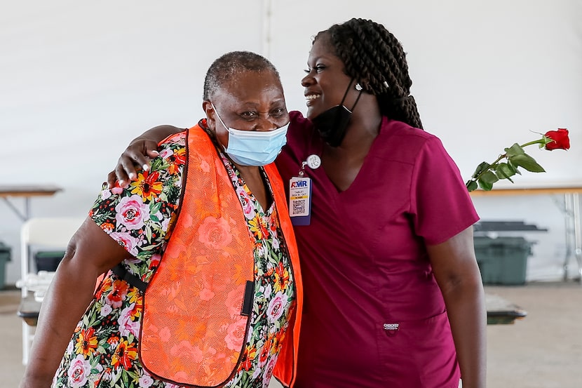 With their work at the mega site done, registered nurse Caroline Chidozie (left) and...