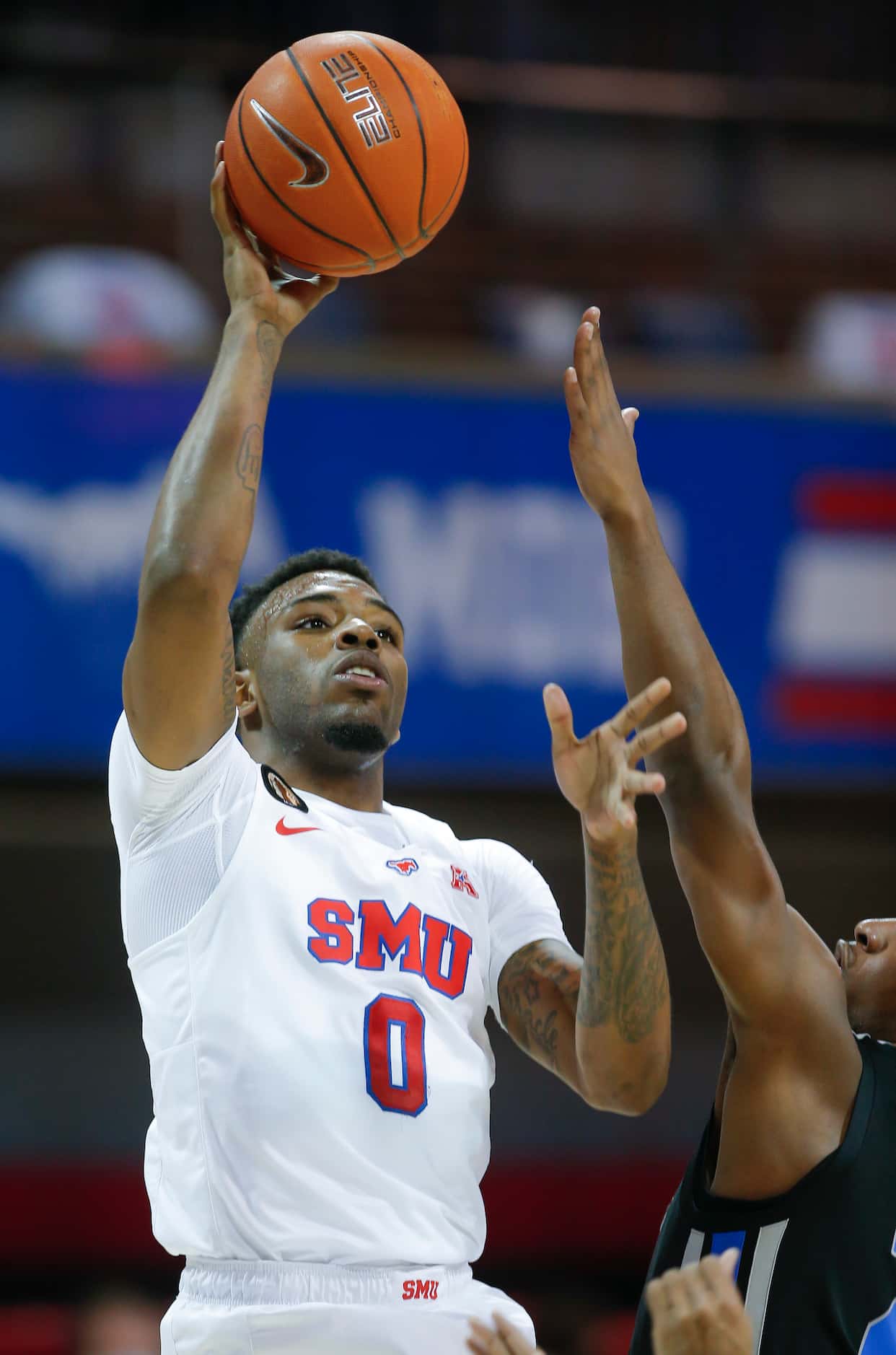 SMU guard Tyson Jolly (0) attempts a shot during the second half of a college basketball...