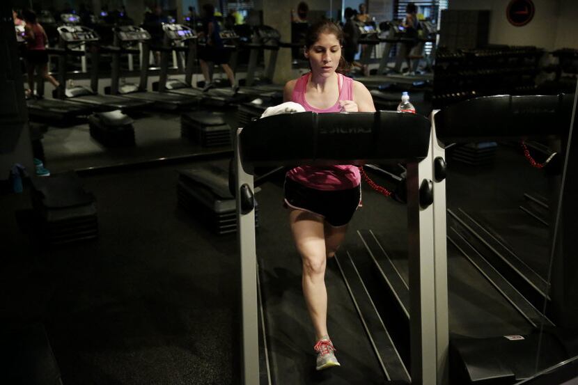 Allison Cavazos runs on the treadmill during the "Cross Tread" class at Tread Fitness in...