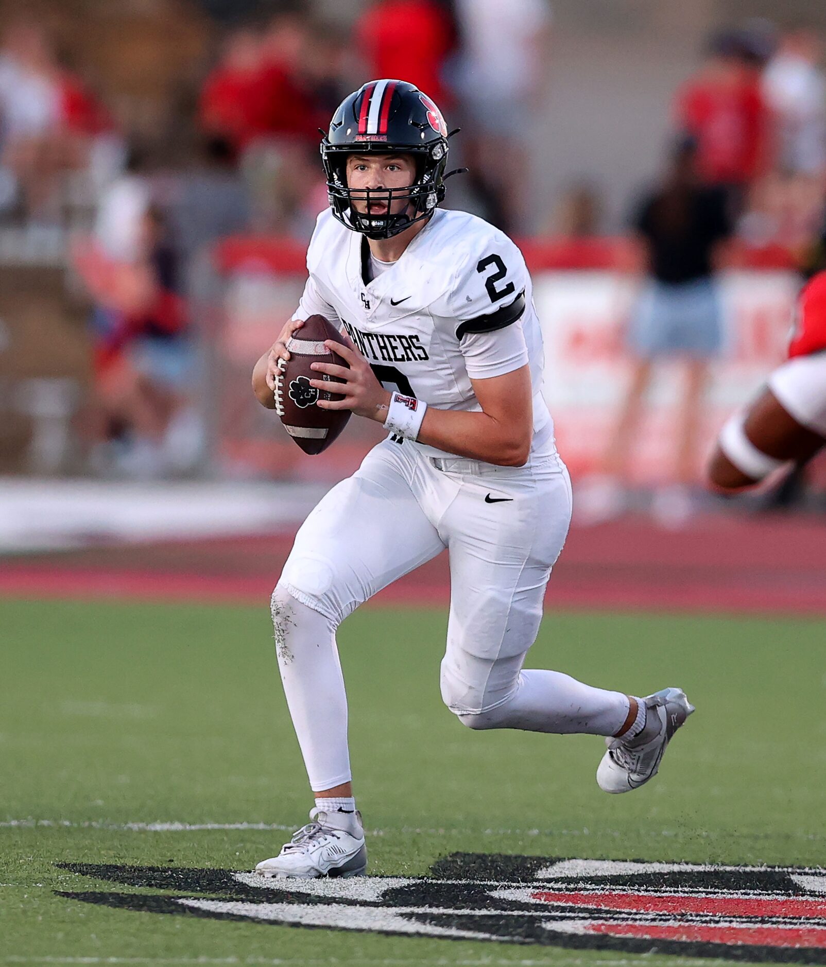 Colleyville Heritage quarterback Bodey Weaver looks to pass against Argyle during the first...