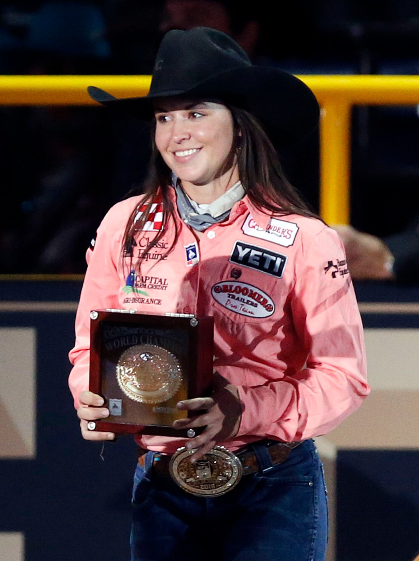 World Champion Barrel Racer Hailey Kinsel of Cotulla, Texas shows her winning belt buckle...