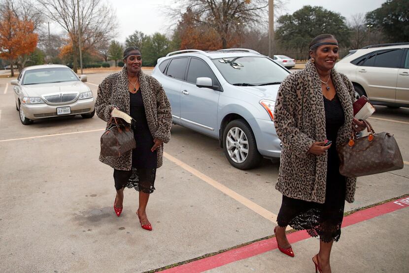 Twin sisters Dolores Swint (left) and Elores Stephens make their way to Greenville Avenue...
