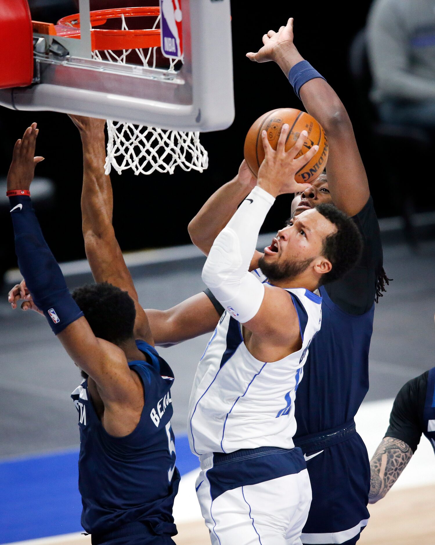 Dallas Mavericks guard Jalen Brunson (13) puts up a shot under the basket against Minnesota...