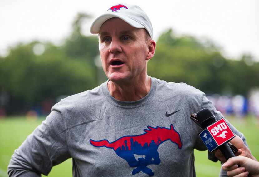 SMU head coach Chad Morris speaks to reporters during SMU's first football practice of the...