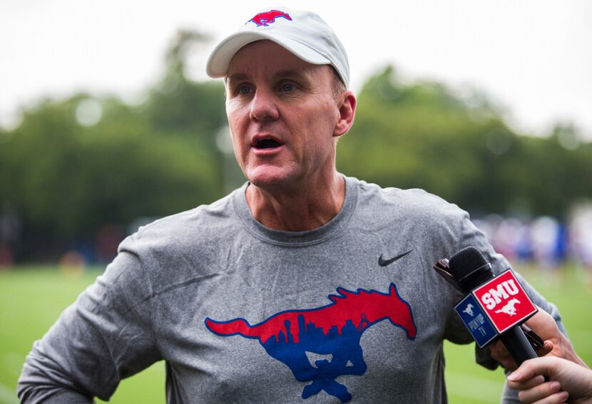 SMU head coach Chad Morris speaks to reporters during SMU's first football practice of the...