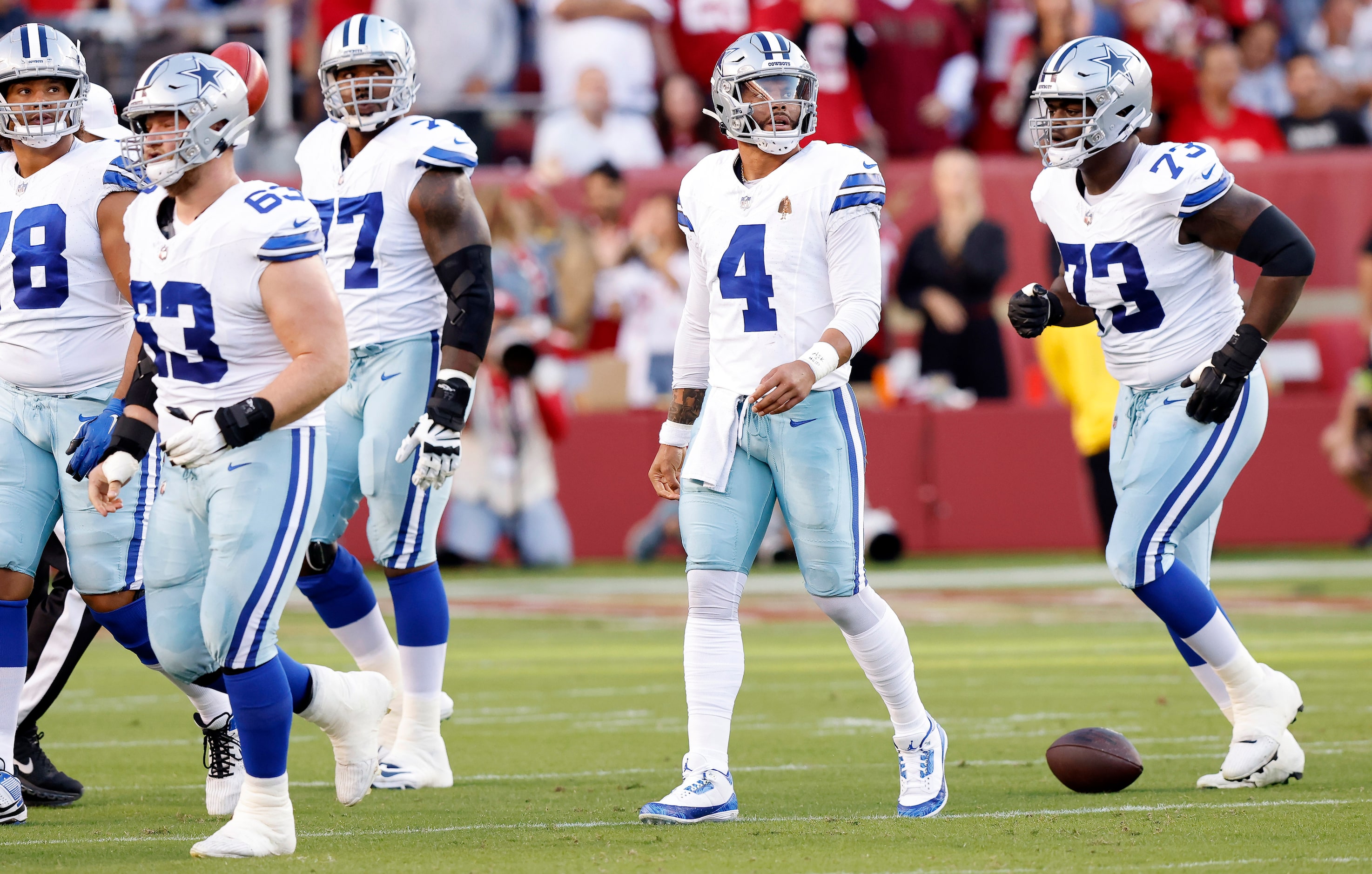 Dallas Cowboys quarterback Dak Prescott (4) looks to the video replay after being sacked on...