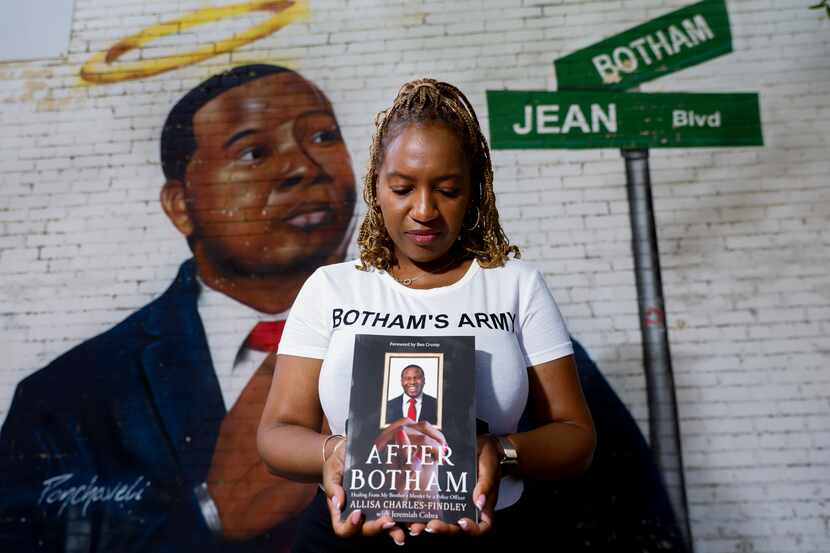 Allisa Charles-Findley poses Tuesday in Dallas in front of a mural of her brother Botham...