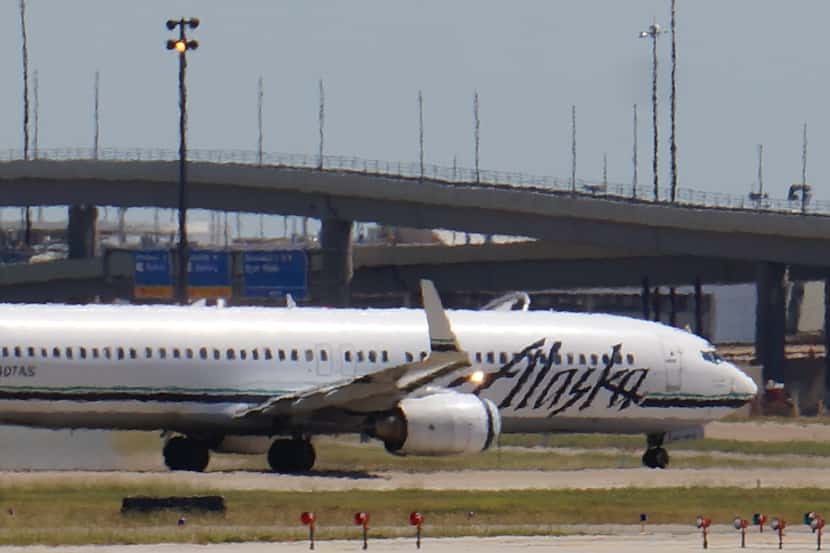 The Alaska Airlines asks that travelers check the status of their flight on its website or...