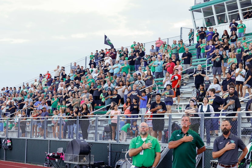 Valley View High School fans stand for the national anthem before a football game, Friday,...