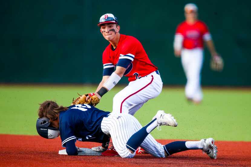 Allen right fielder Sam Haigwood (10) loses his helmet as he steals second base as McKinney...