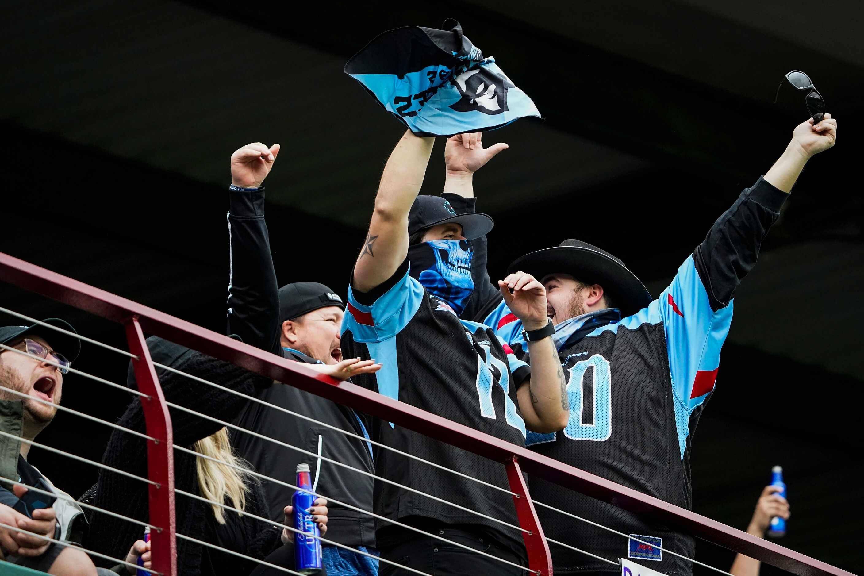 Dallas Renegades fans cheer after their team recovered a St. Louis Battlehawks fumble during...