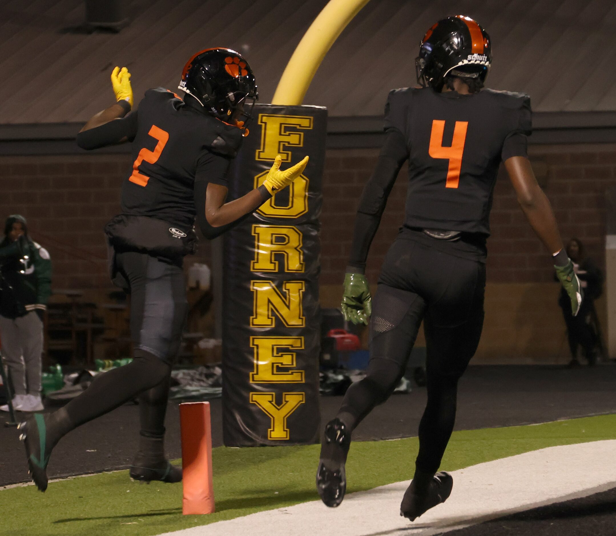 Lancaster receiver Kewan Lacy (2), left, celebrates an 87-yard rushing touchdown with...