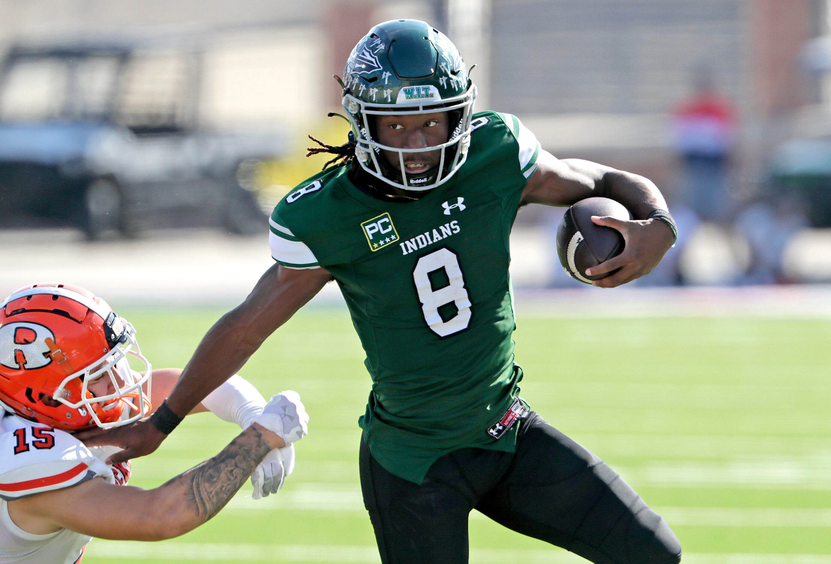 Waxahachie High School quarterback Ramon McKinney Jr. (8) breaks free from Rockwall High...