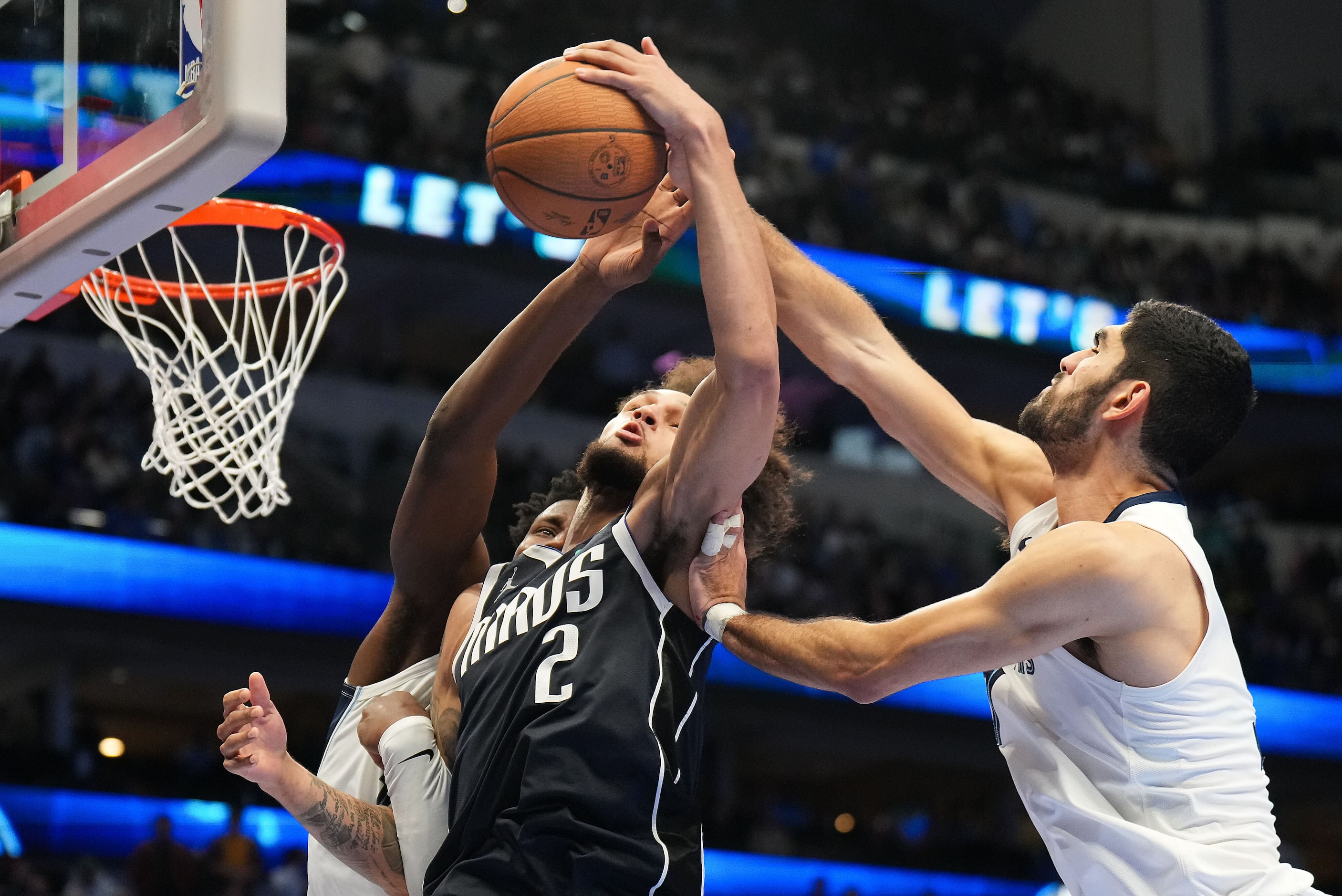 Dallas Mavericks center Dereck Lively II (2) fights for a rebound against Memphis Grizzlies...