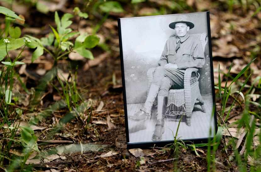 
Bill Jordan placed a photo of his grandfather on the spot where the dog tag was discovered...