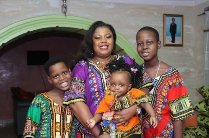 Gloria Adekilekun and her three children, with Ayodeji at right. 