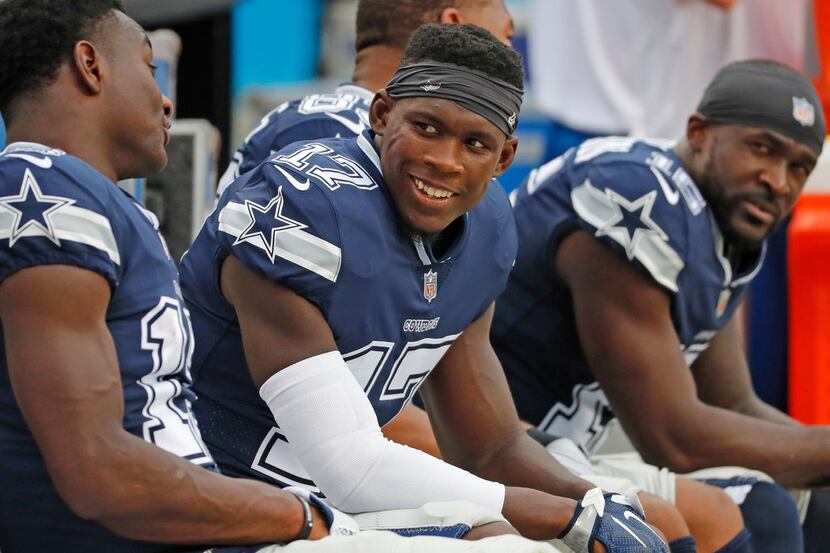 Dallas Cowboys wide receiver Allen Hurns (17) talks with teammates on the bench during the...