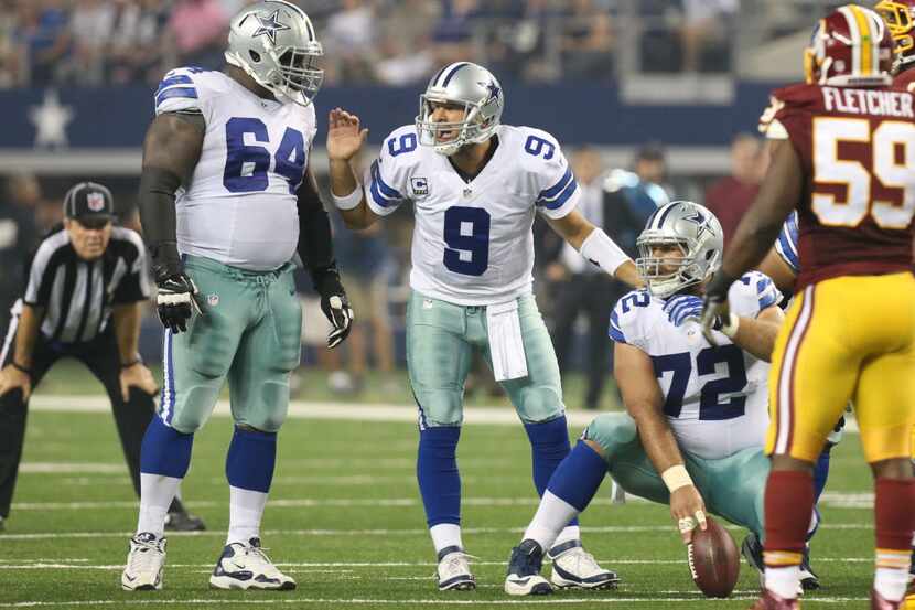 Dallas Cowboys quarterback Tony Romo (9), guard Brian Waters (64) and center Travis...