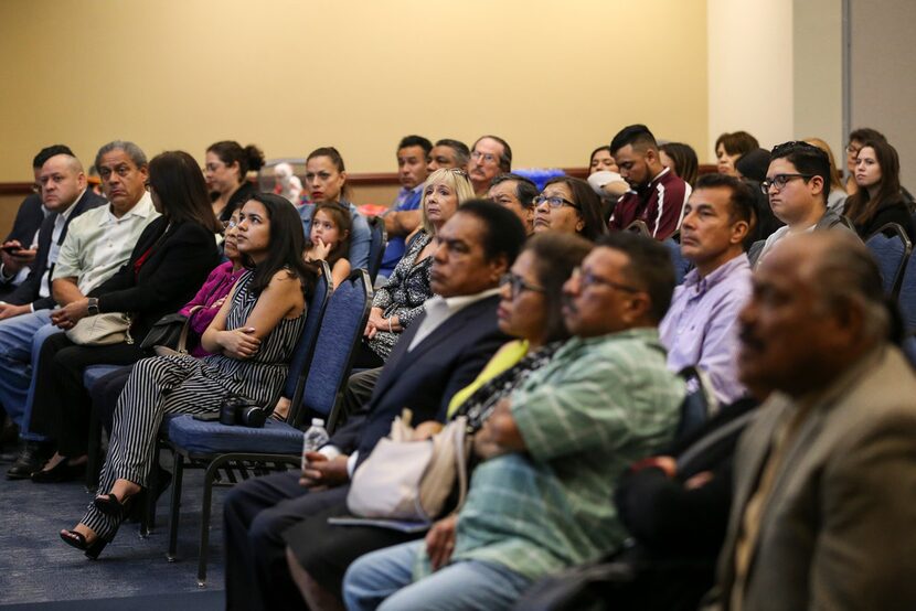 People listen as state Sen. Royce West, D-Dallas, speaks during a town hall meeting...