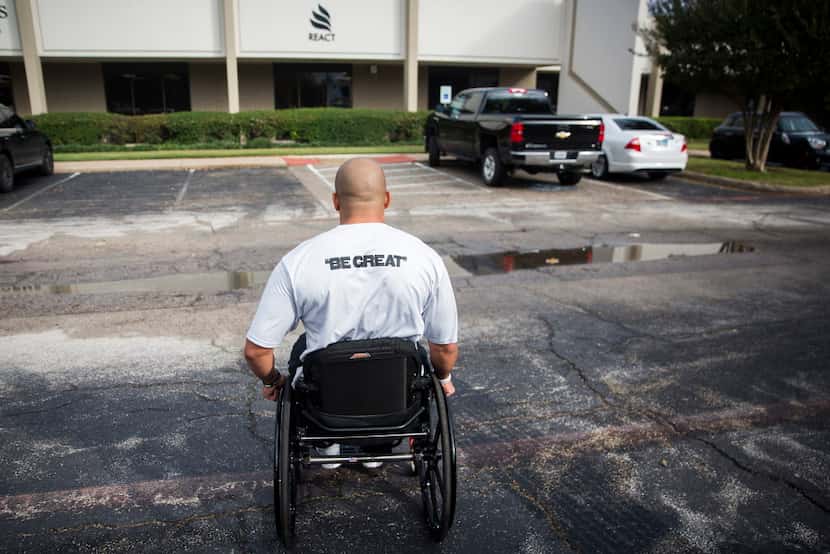 Corey Wilson wheels himself to a therapy session at REACT Spinal Cord Recovery on Thursday,...