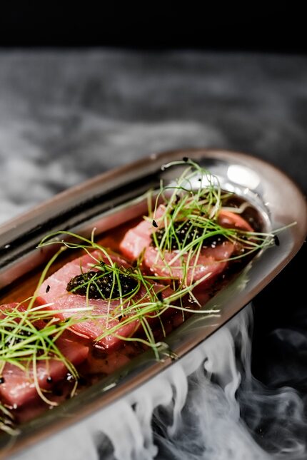 The big eye tuna sashimi at Harper's is served with caviar and truffle ponzo. It froths when...