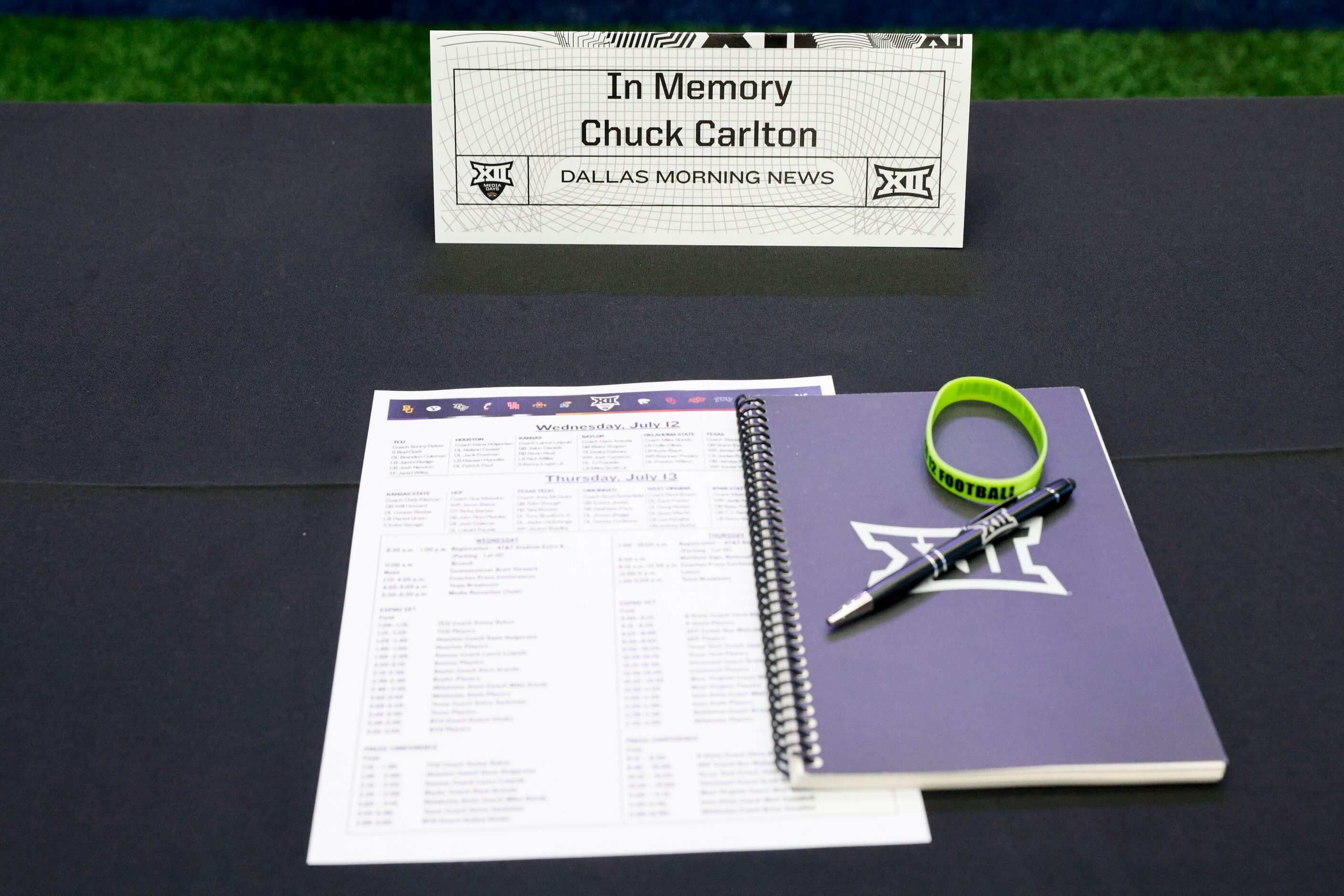 A chair is reserved in memory of The Dallas Morning News sportswriter Chuck Carlton at the...