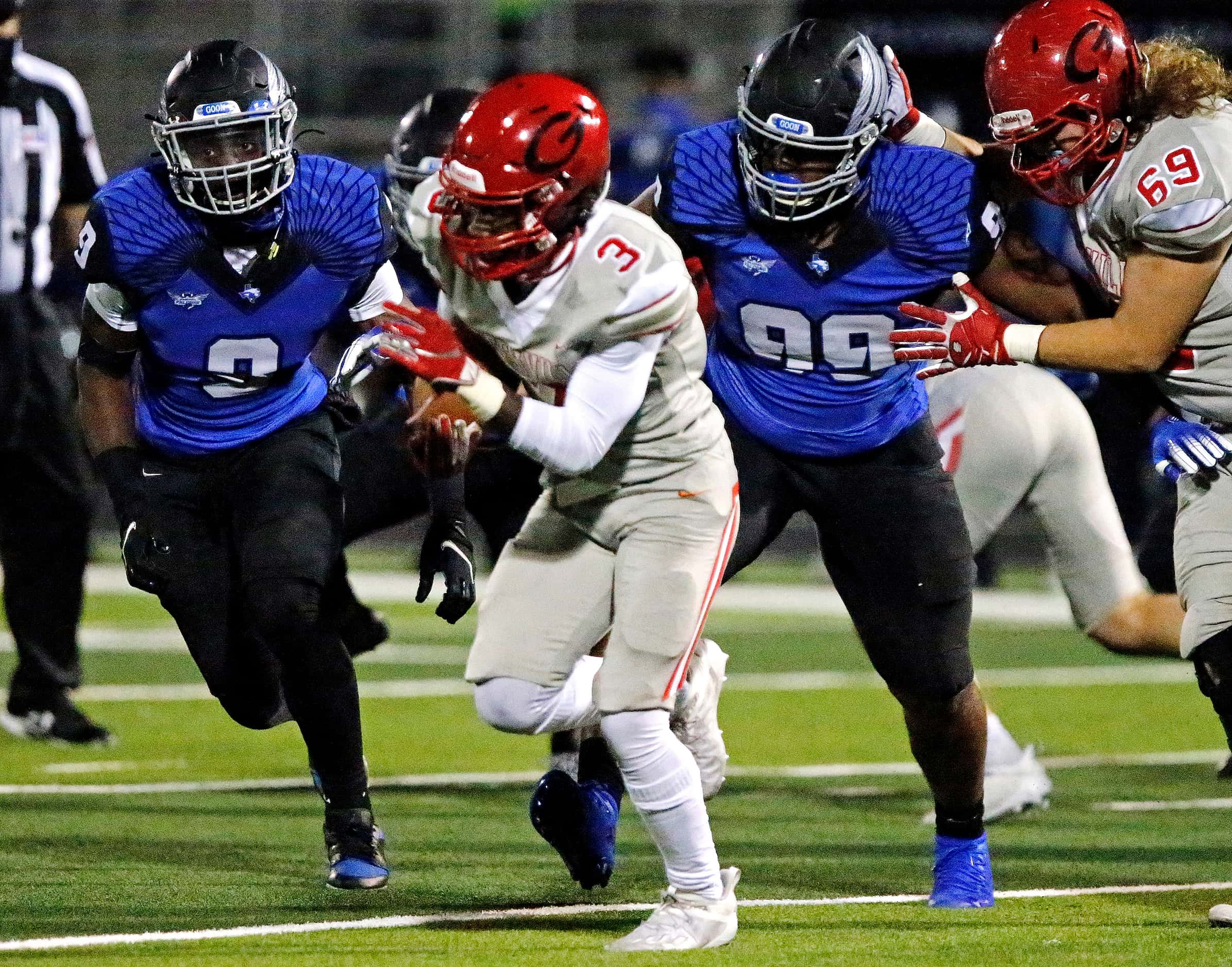 Greenville High School running back Miles Denson (3) looks to run past North Forney High...