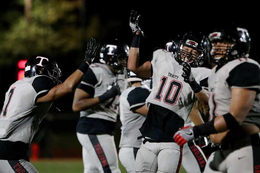 Euless Trinity linebacker Jeremiah Kneubuhl (10) celebrates after a turnover on downs in the...