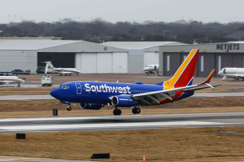 A Southwest Airlines plane lands at the runway of Dallas Love Field Airport in Dallas on...