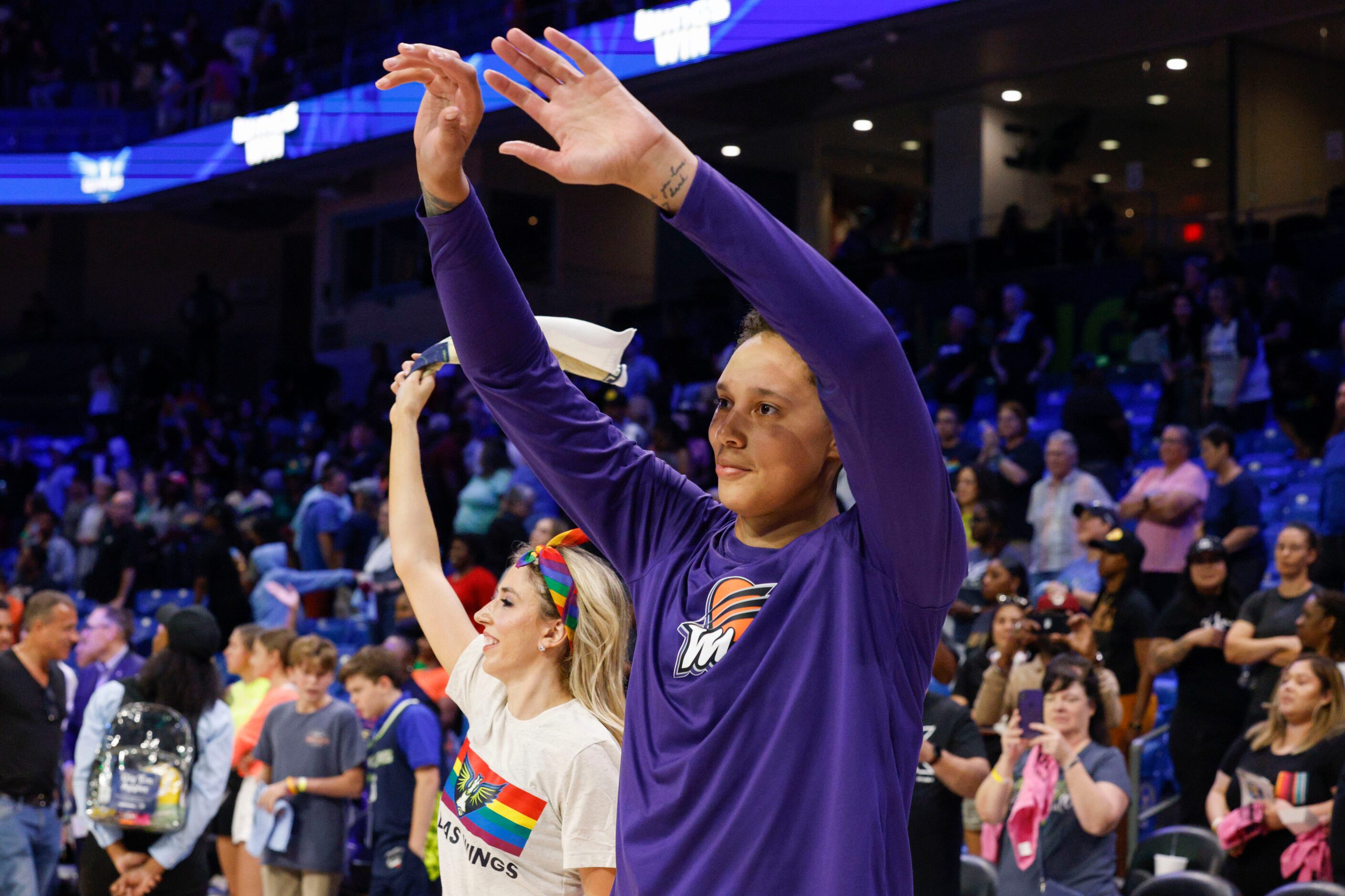 Phoenix Mercury center Brittney Griner waves bye to fans after a game against the Dallas...