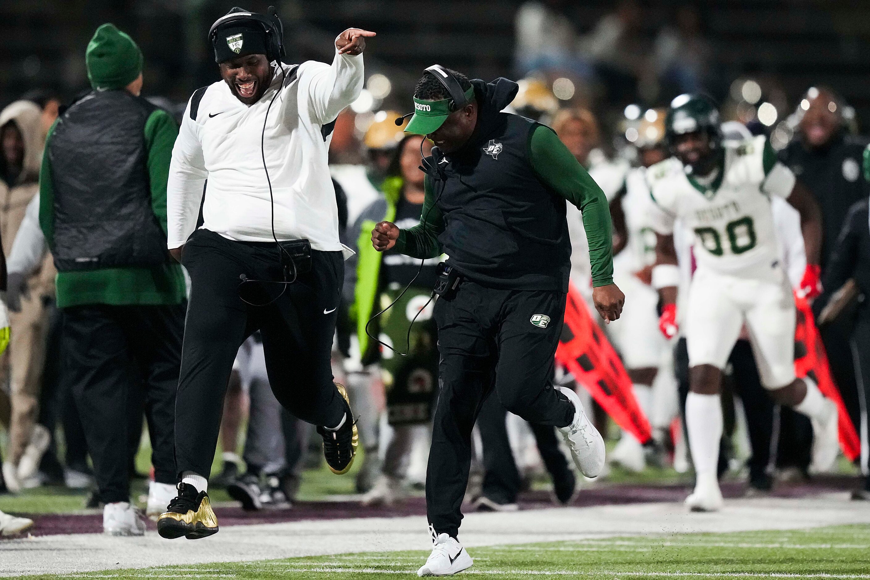 DeSoto head coach Claude Mathis head coach Claude Mathis (center) celebrates after wide...