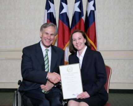  Then-Attorney General Greg Abbott presented Martha Fitzwater Pigott with an award on July...