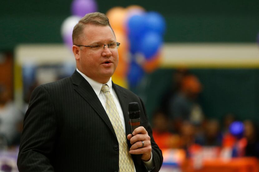Todd Peterman speaks during a national signing day ceremony at DeSoto on Feb. 1, 2017. (Rose...