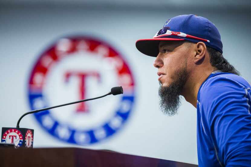 Texas Rangers starting pitcher Yovani Gallardo (49) speaks to media at a press conference...
