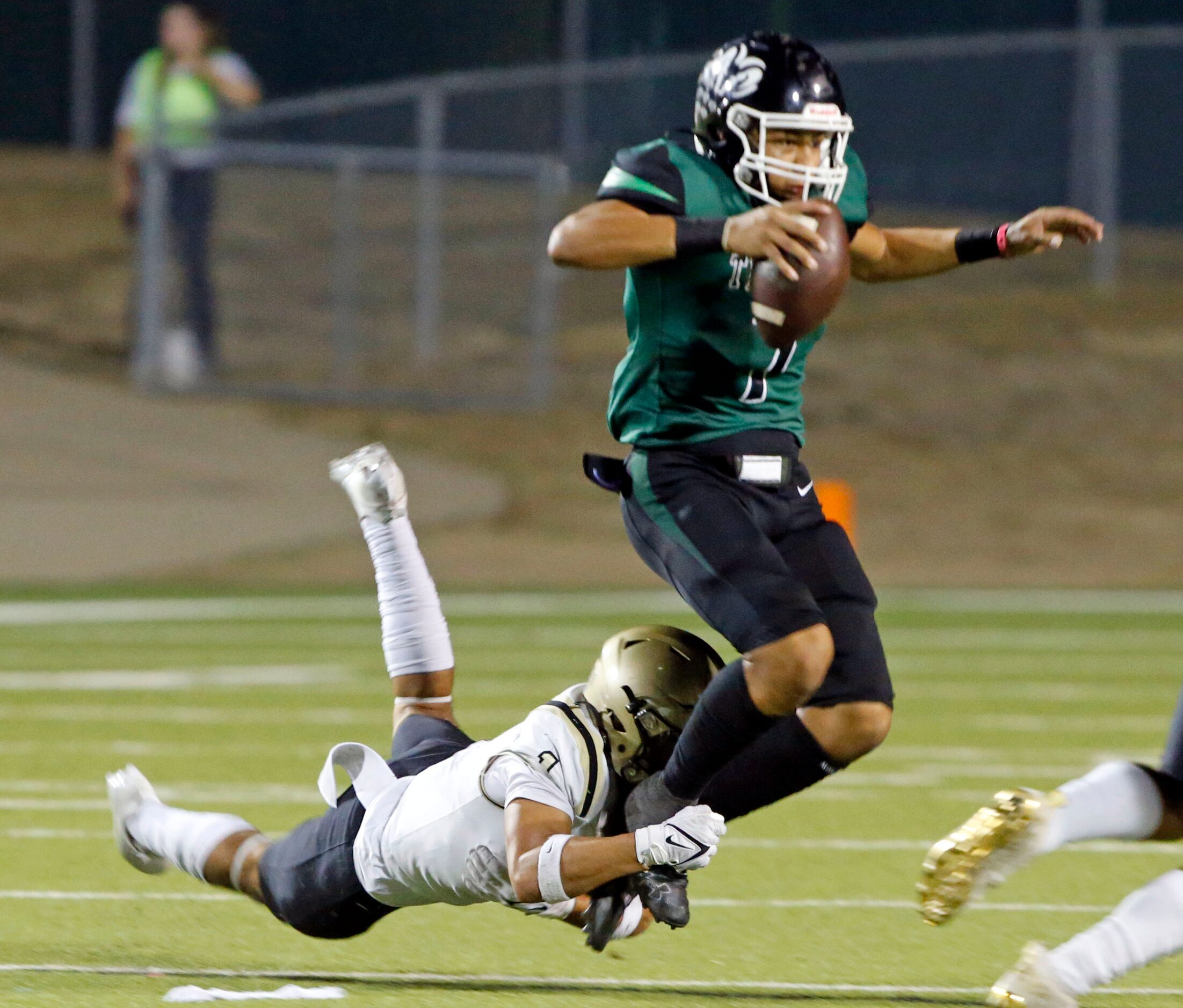 Irving high defender Christopher Alvarez (1) catches Richardson Berkner high QB Cornell...