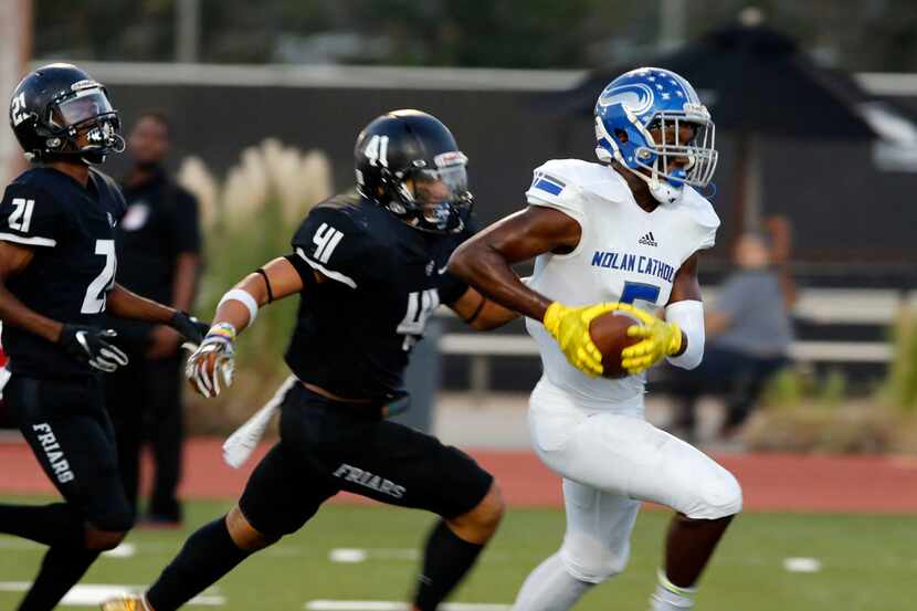 Fort Worth Nolan WR Marvin Young (5) is chased by Bishop Lynch defender Plae Wyatt (41)...