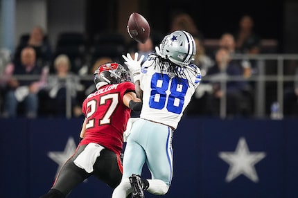 Dallas Cowboys wide receiver CeeDee Lamb (88) hauls in a long pass as Tampa Bay Buccaneers...