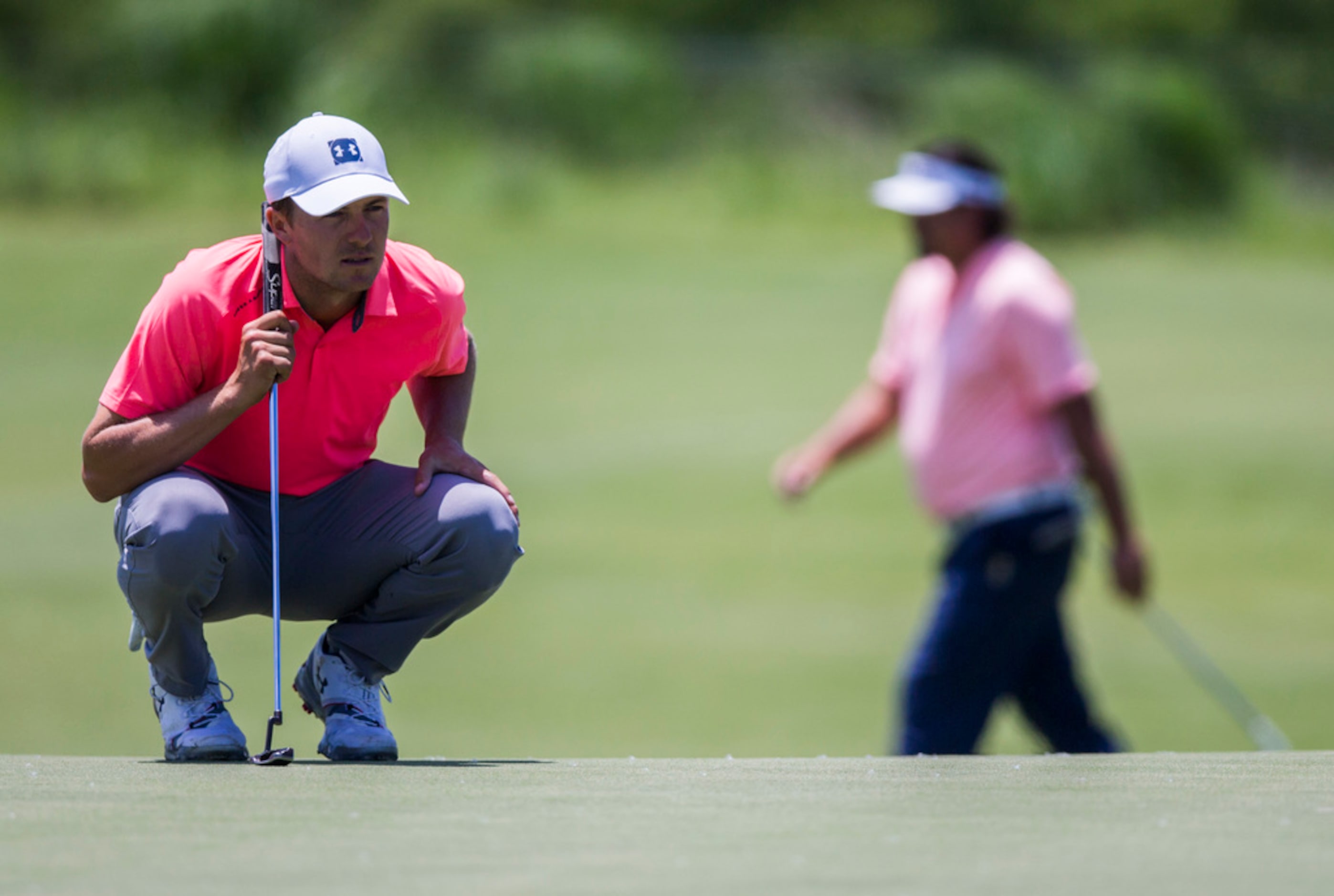 Jordan Spieth lines up a shot on the second green during round 4 of the AT&T Byron Nelson...