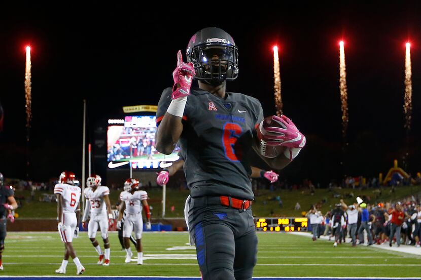 FILE - SMU running back Braeden West (6) scores the final touchdown in the fourth quarter as...