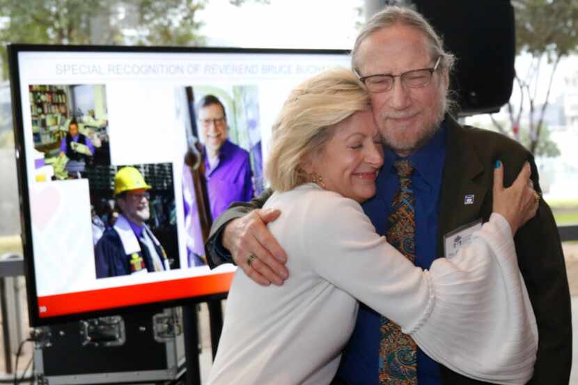 Camille Grimes, executive director, The Dallas Morning News Charities, hugs the Rev. Bruce...