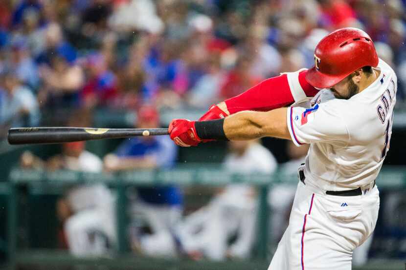 Texas Rangers third baseman Joey Gallo (13) hits a home run during the fourth inning of an...