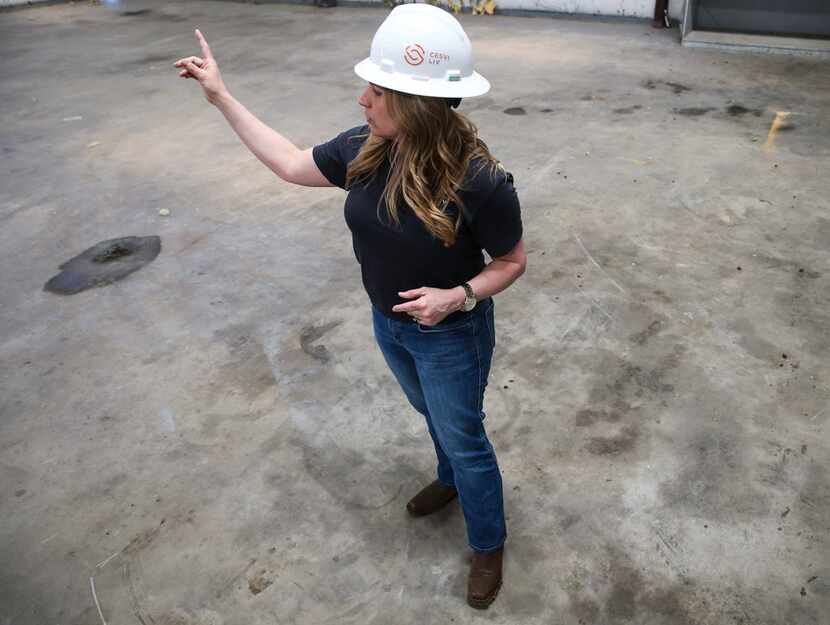 Chris Mullen, vice president of research at Solera, walks around a warehouse that will be...