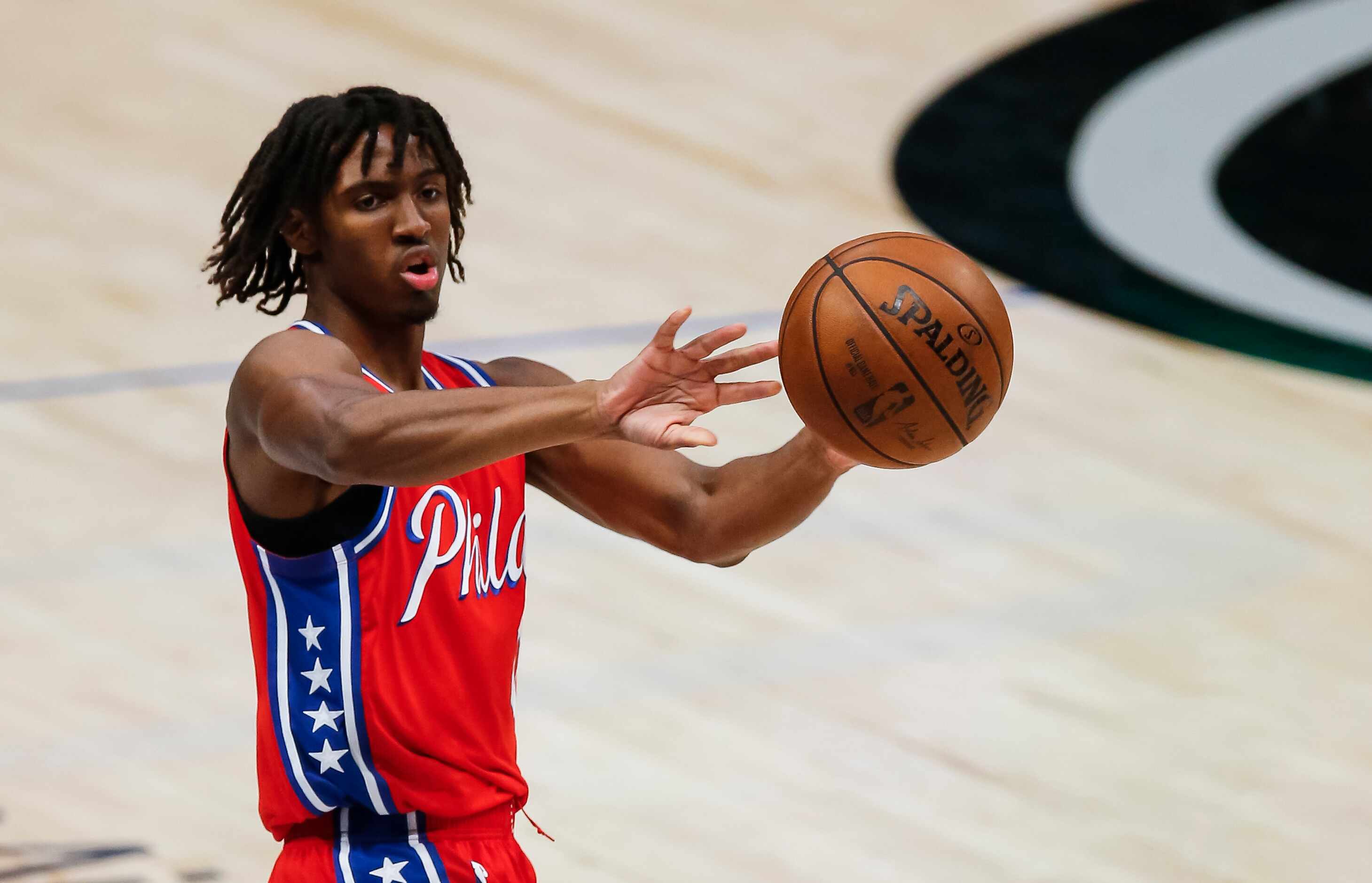Philadelphia 76ers guard Tyrese Maxey (0) passes during the second half of an NBA basketball...