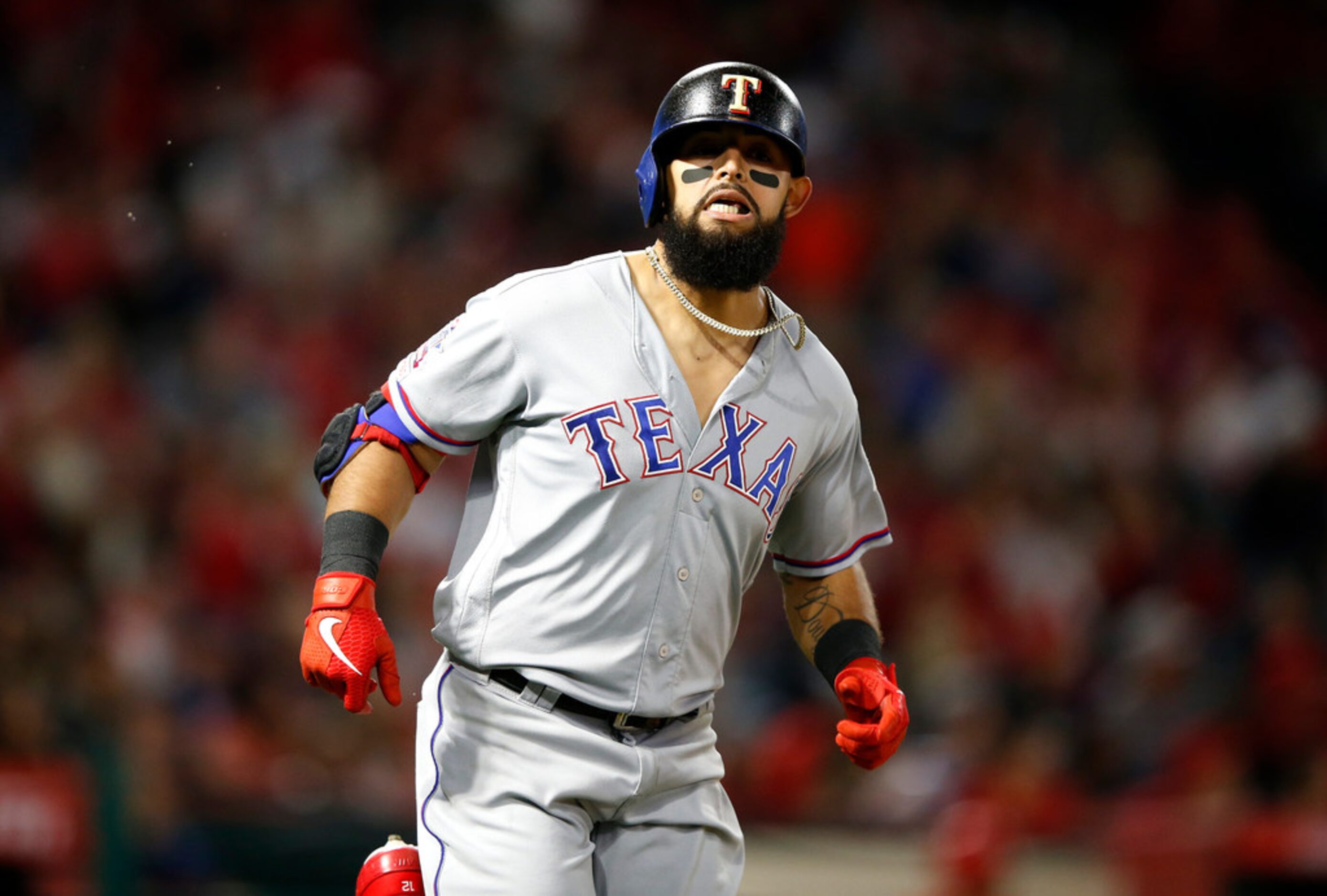 ANAHEIM, CALIFORNIA - MAY 24:  Rougned Odor #12 of the Texas Rangers reacts to flying out...